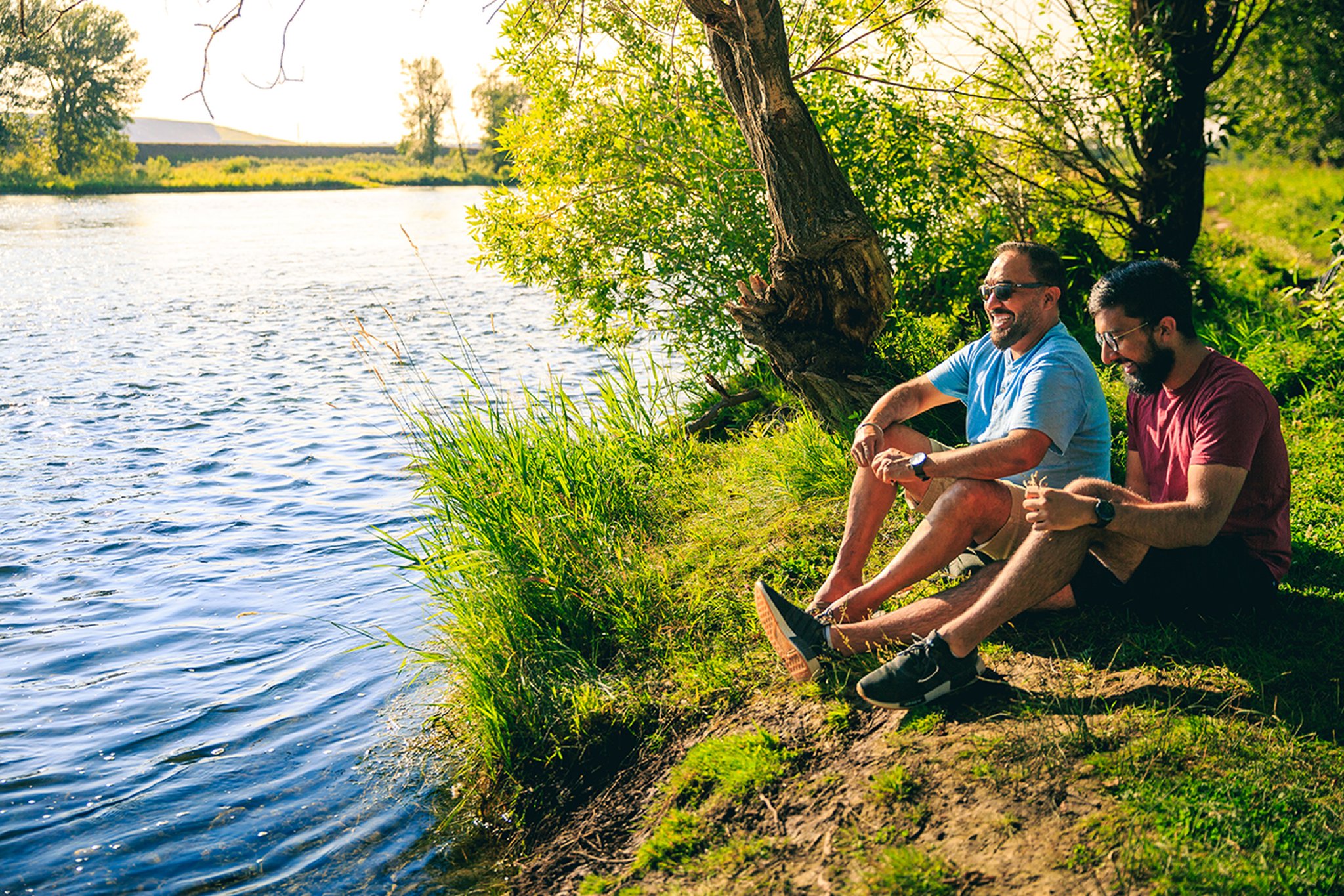 men by lake
