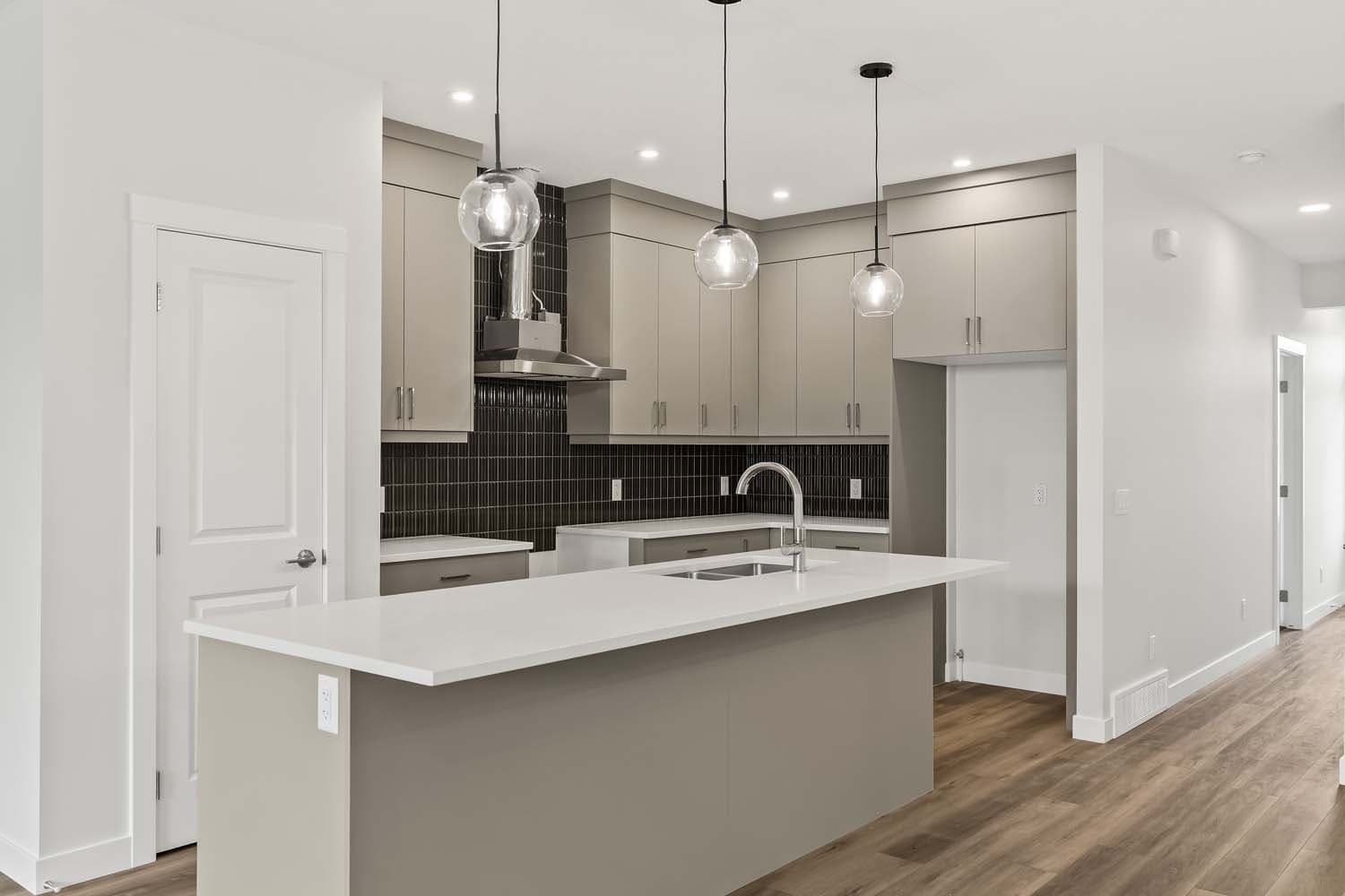 Kitchen of quick possession home in Chinook Gate Airdrie