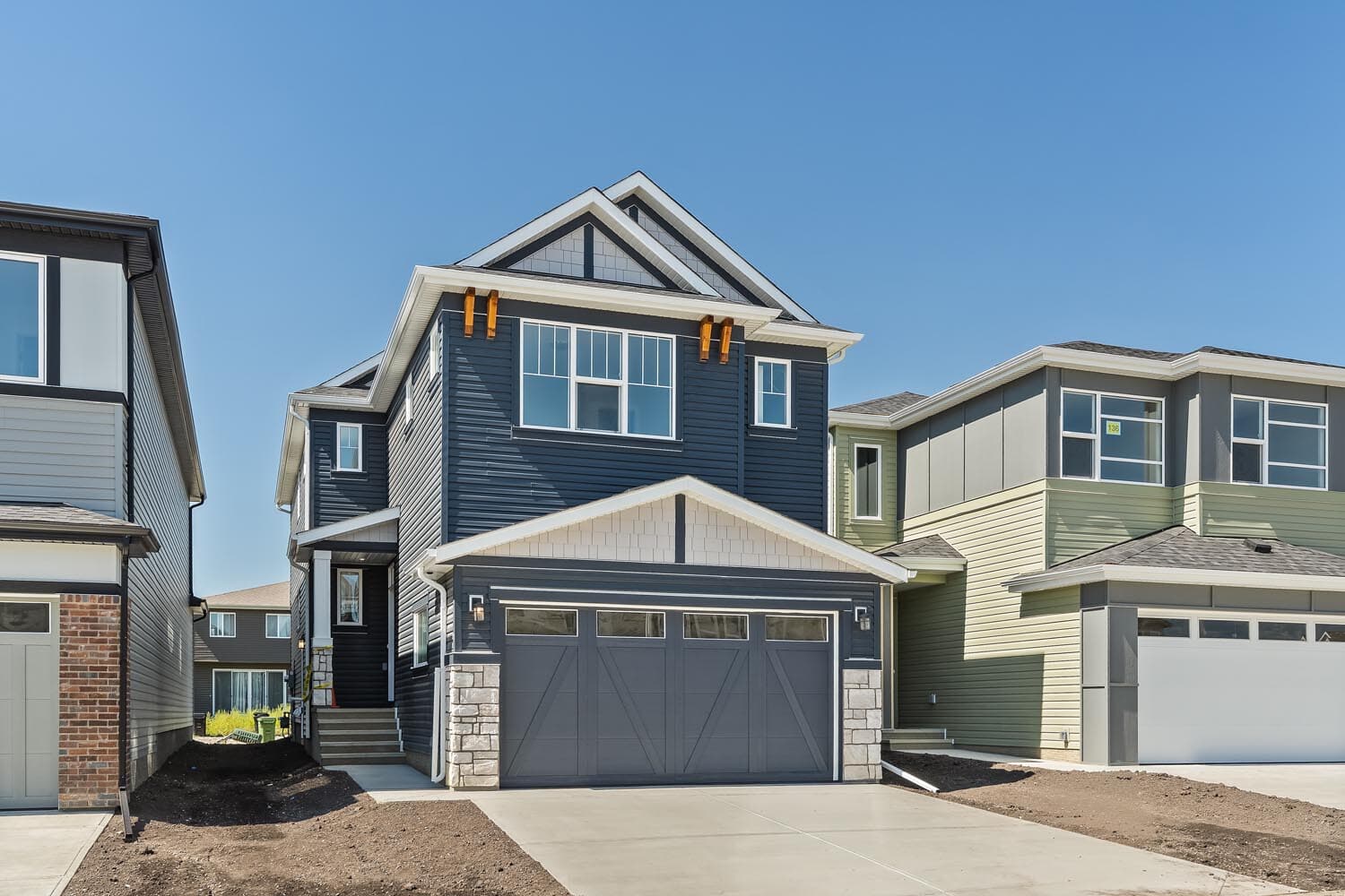 A photo of the front garage quick possession home at 144 Creekstone Circle SW in Creekstone by Brookfield Residential