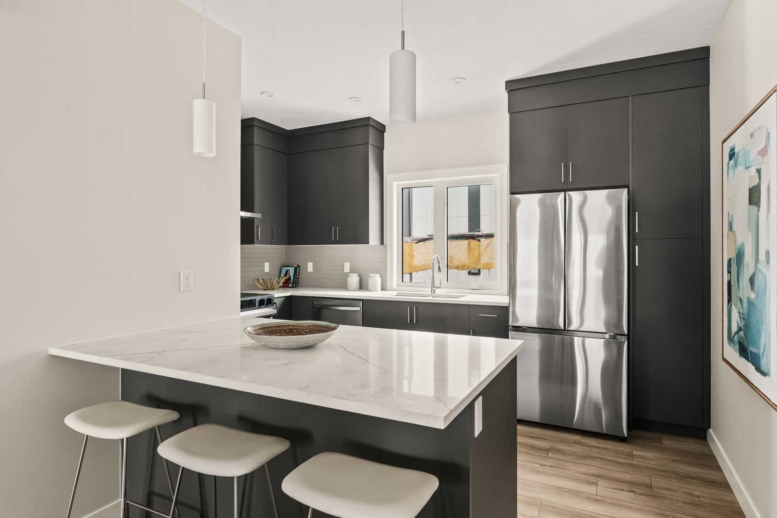 A photo of the kitchen in the Geranium townhome model in Taza Park by Brookfield Residential