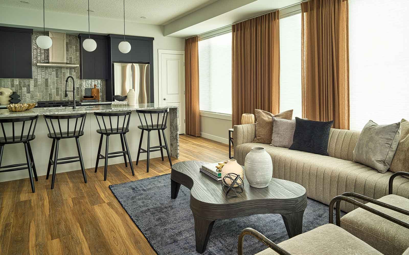 A photo of the kitchen and great room of the Brubeck townhome model in Calgary by Brookfield Residential