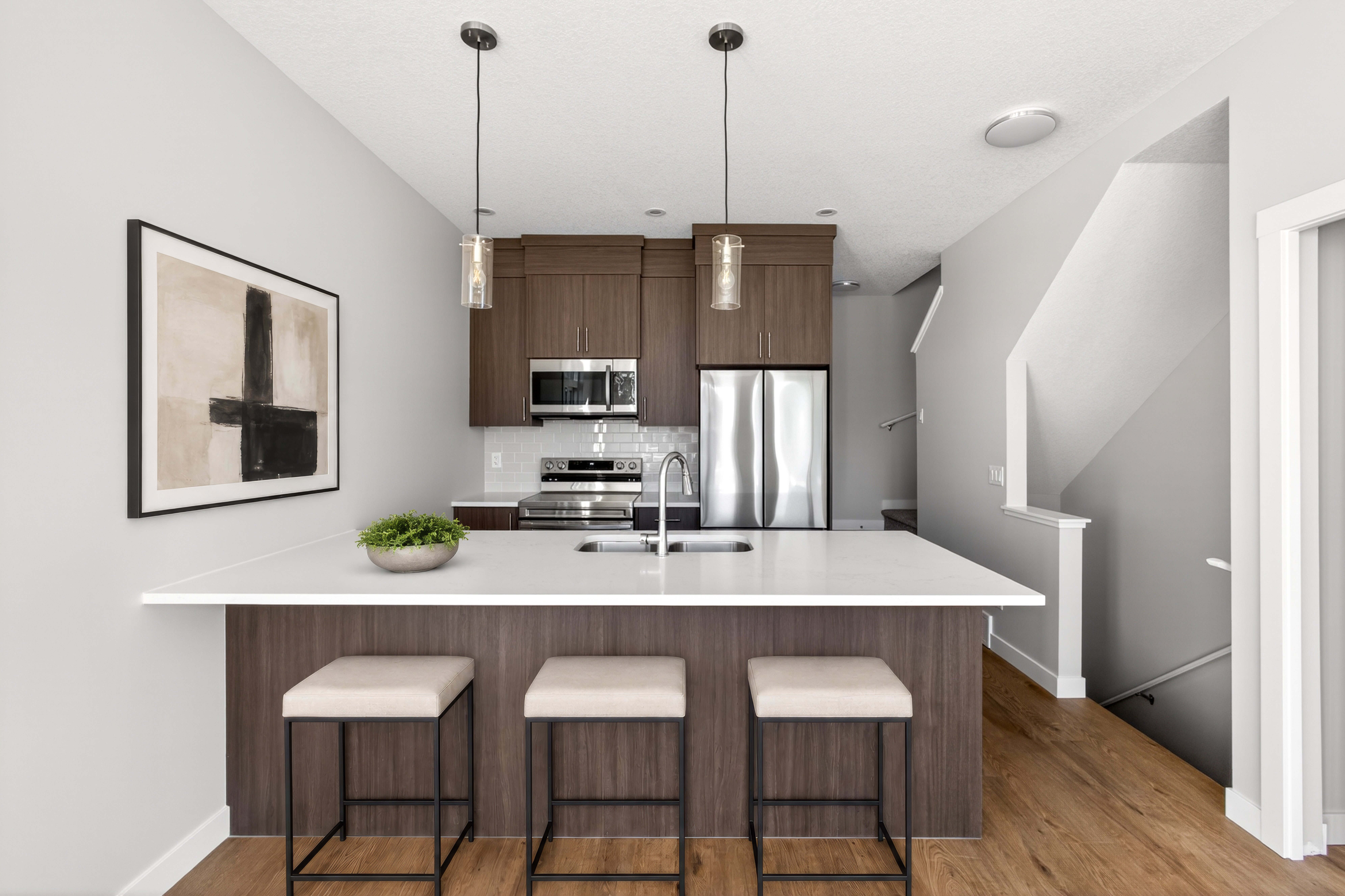 A photo of the kitchen of the Fitzgerald townhome model in Calgary by Brookfield Residential