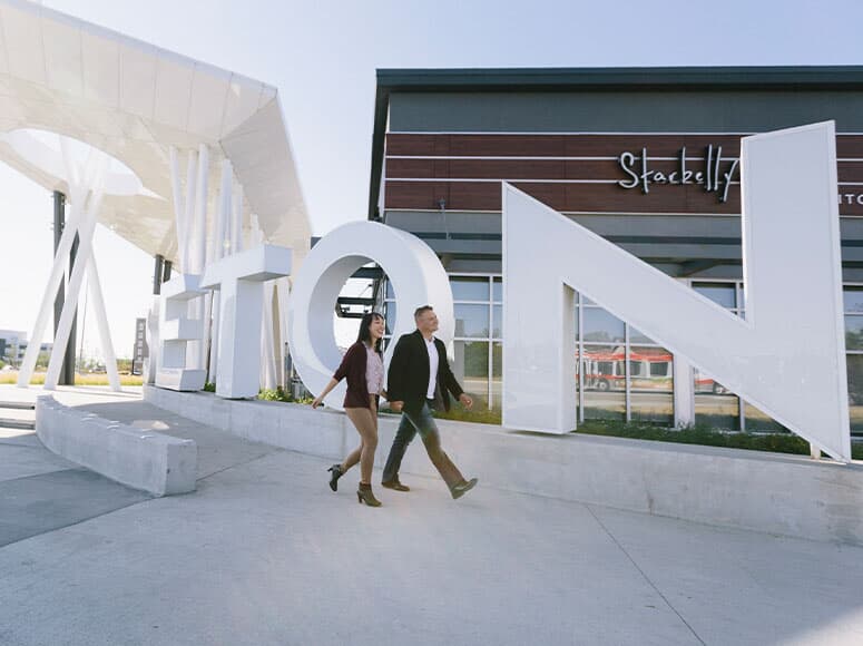A couple walking the Seton Urban District.