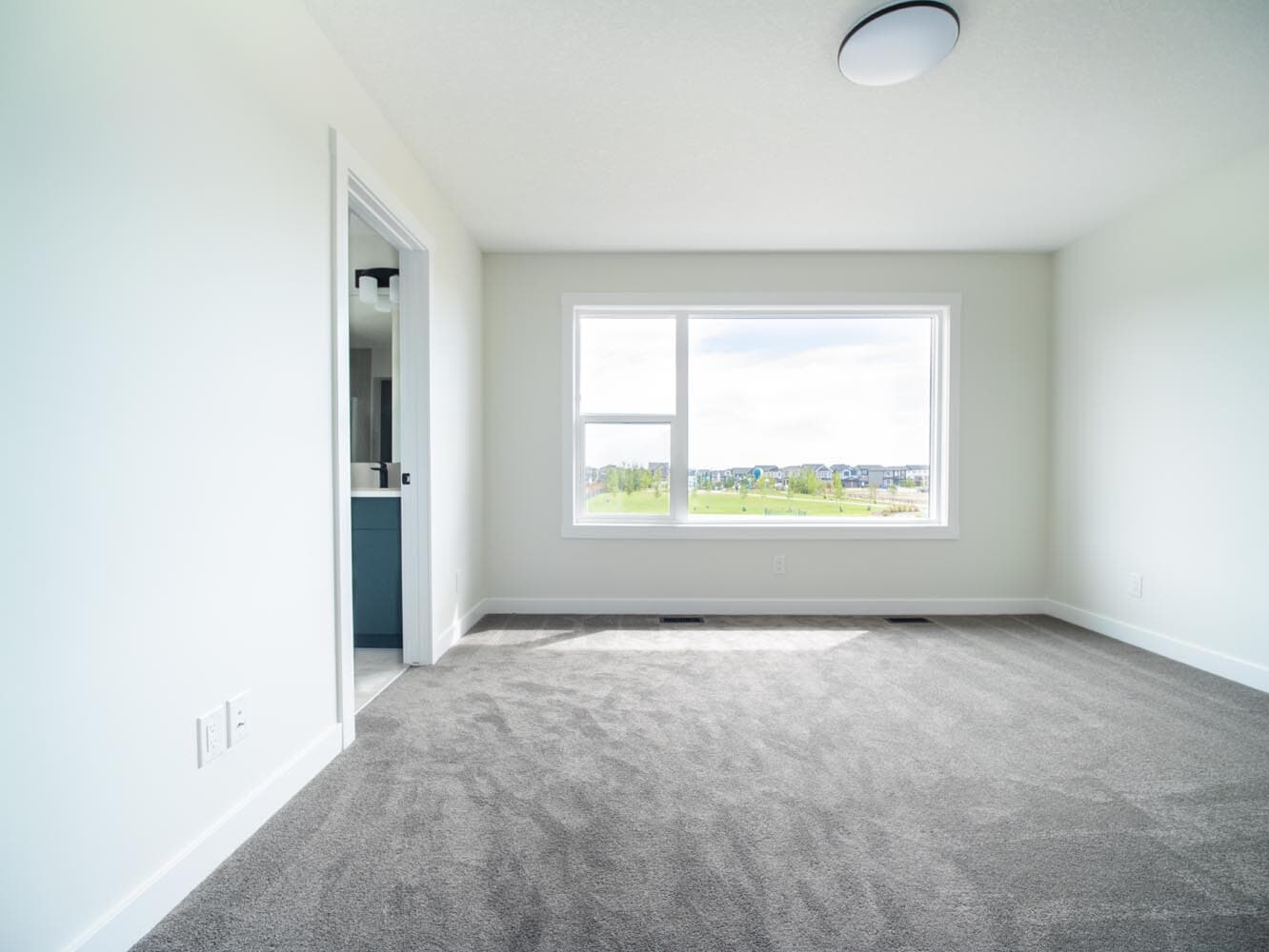A photo of the front garage quick possession home at 143 Creekstone Circle SW in Creekstone by Brookfield Residential