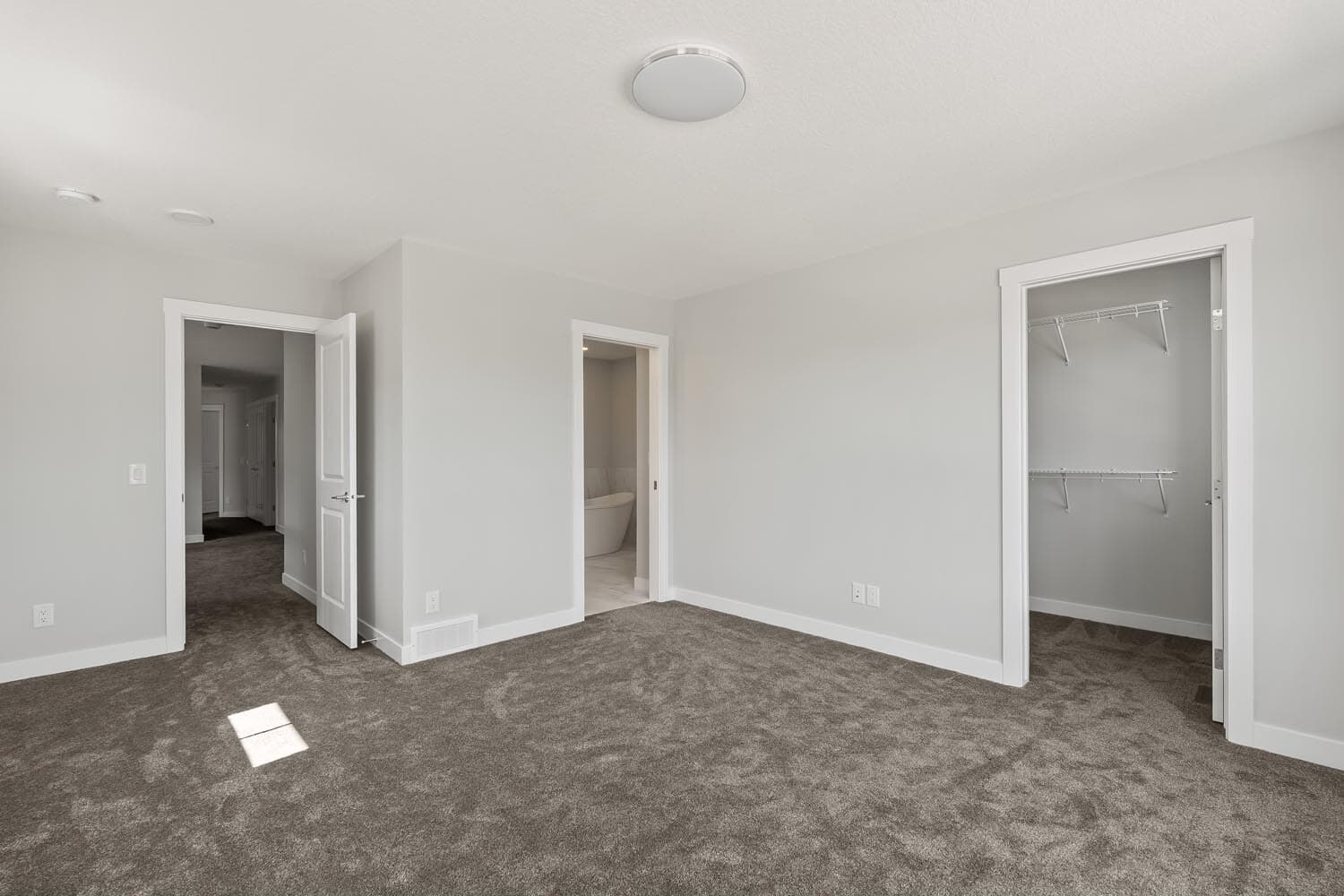 A photo of the front garage quick possession home at 144 Creekstone Circle SW in Creekstone by Brookfield Residential