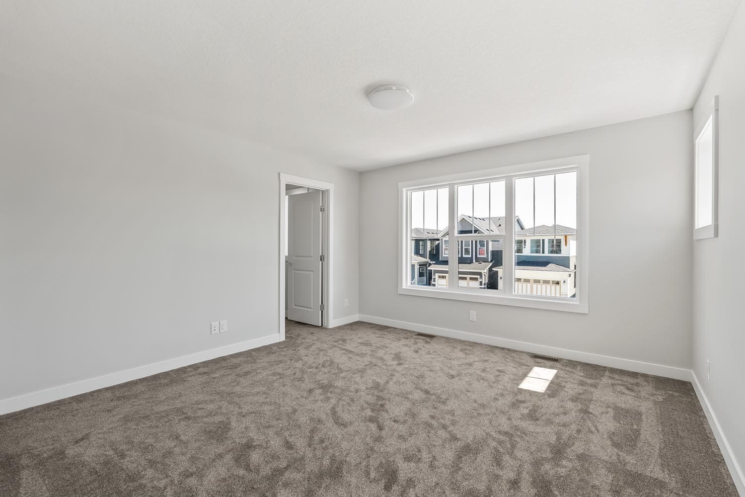 A photo of the front garage quick possession home at 144 Creekstone Circle SW in Creekstone by Brookfield Residential