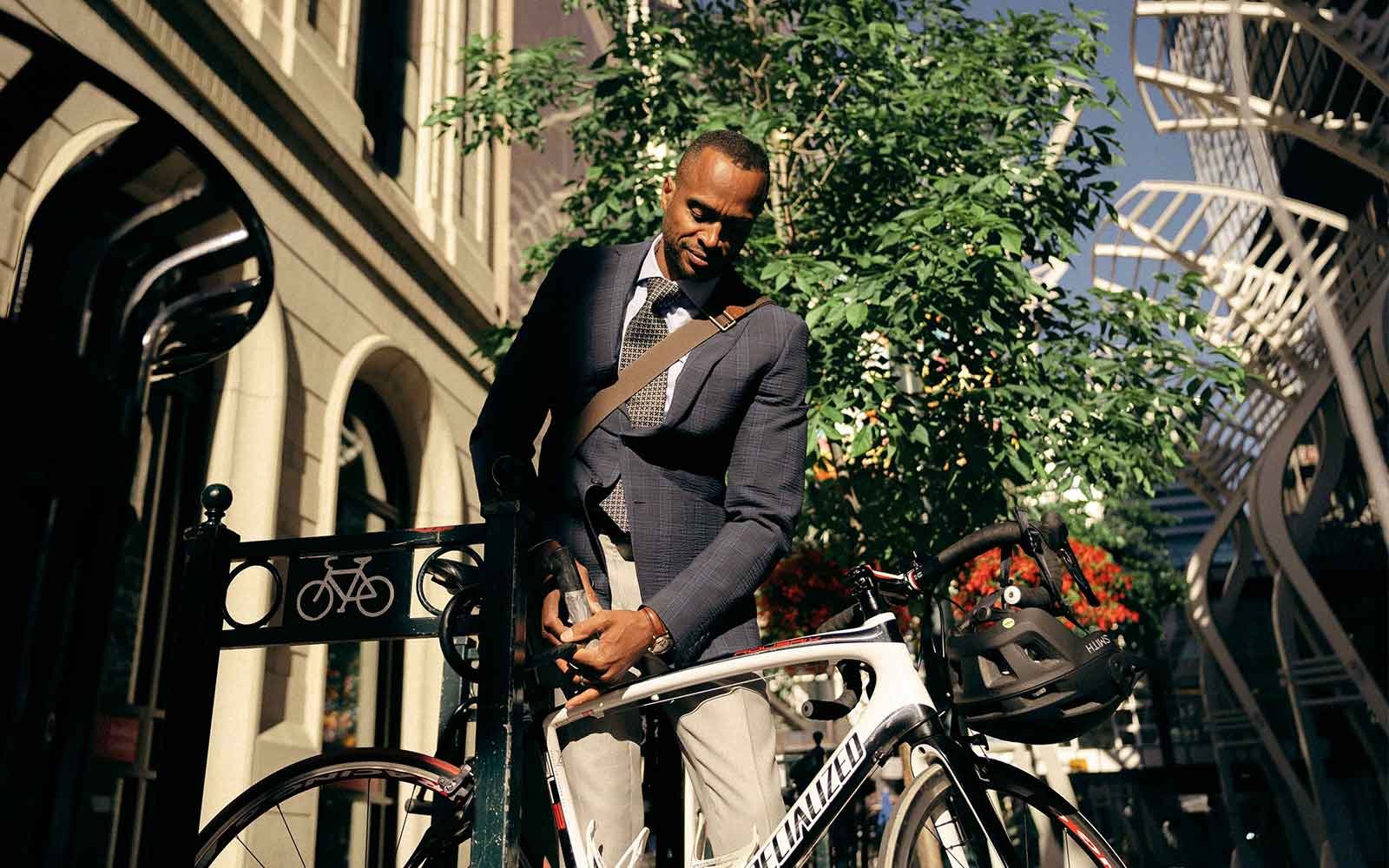 Man parking a bike in downtown Calgary