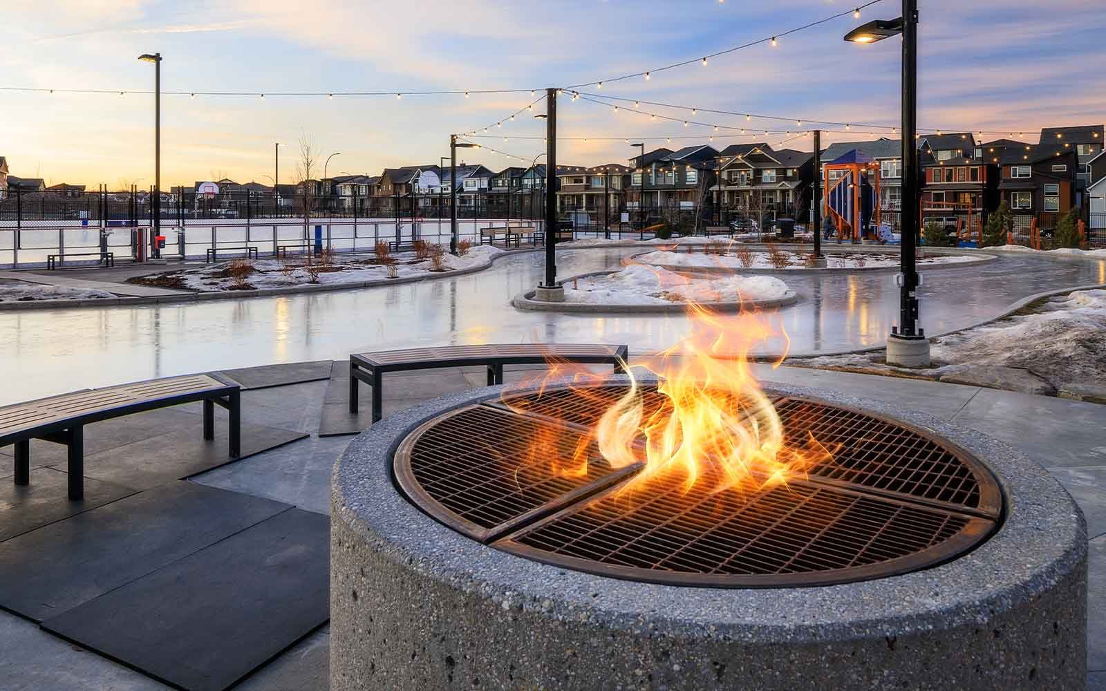 Photo of  skating rink and fireplace at The Lodge in Rockland Park by Brookfield Residential