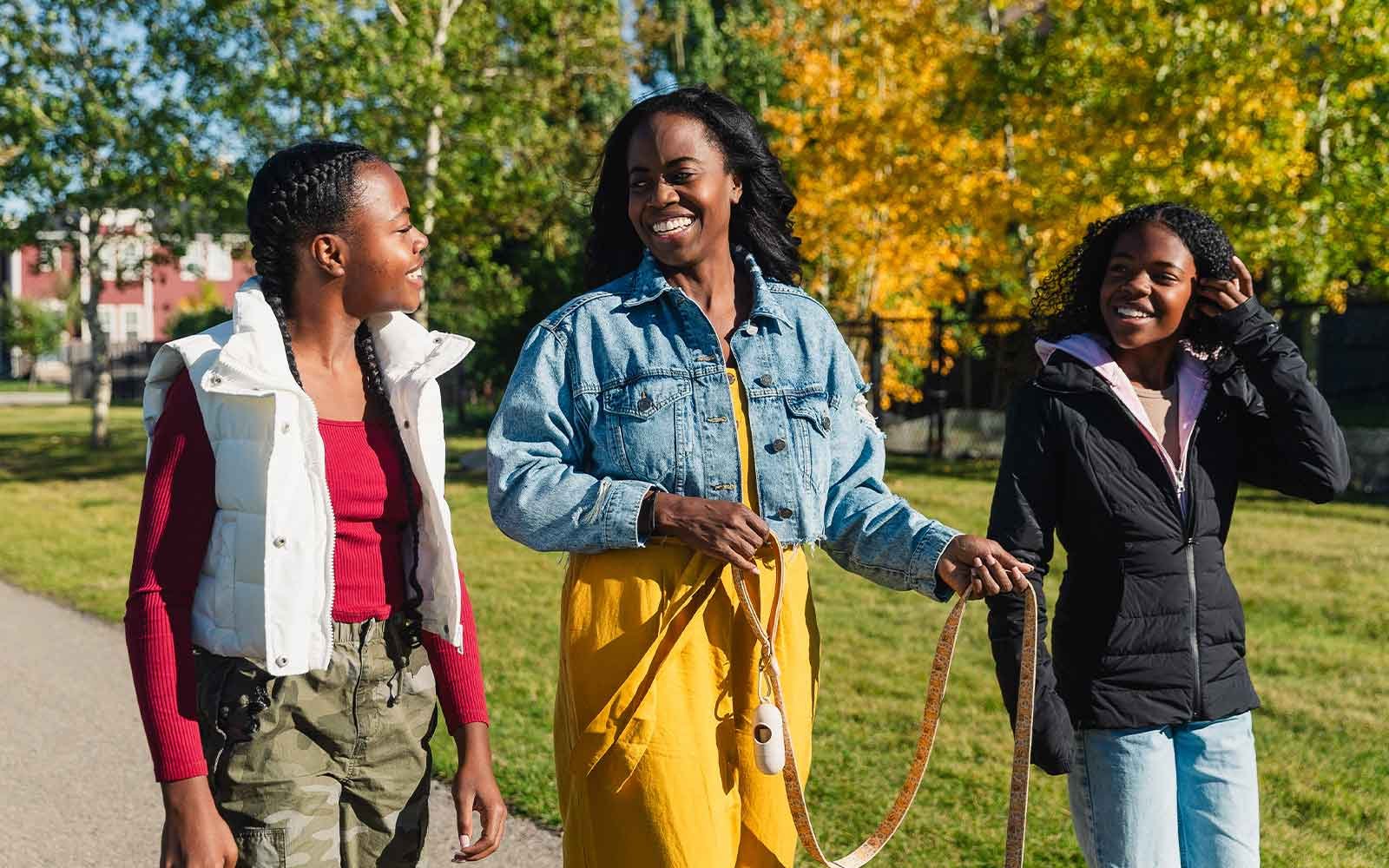 A family enjoys a walk on a pathway in Silver Spruce
