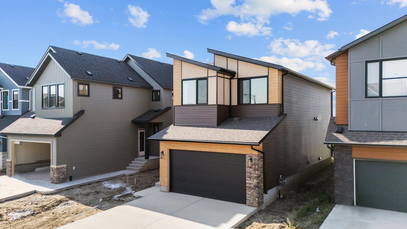 A photo of the front garage quick possession home at 2125 Muckleplum Crescent SW in The Orchards by Brookfield Residential