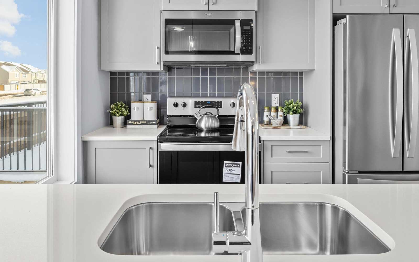 A photo of the kitchen of the Coltrane townhome model by Brookfield Residential