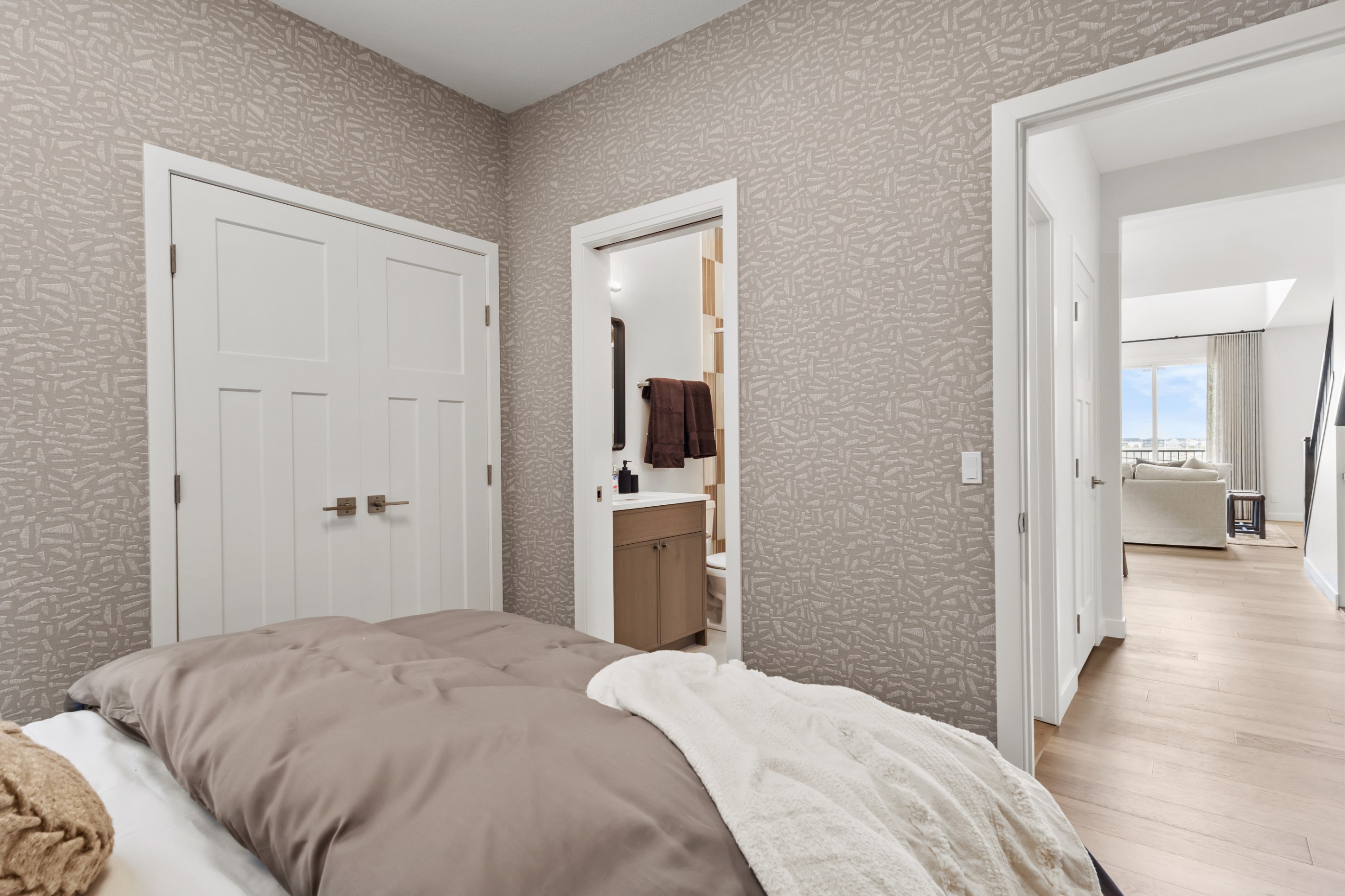 A photo of the bedroom on the main floor of the Waterton 26 model in Edmonton by Brookfield Residential