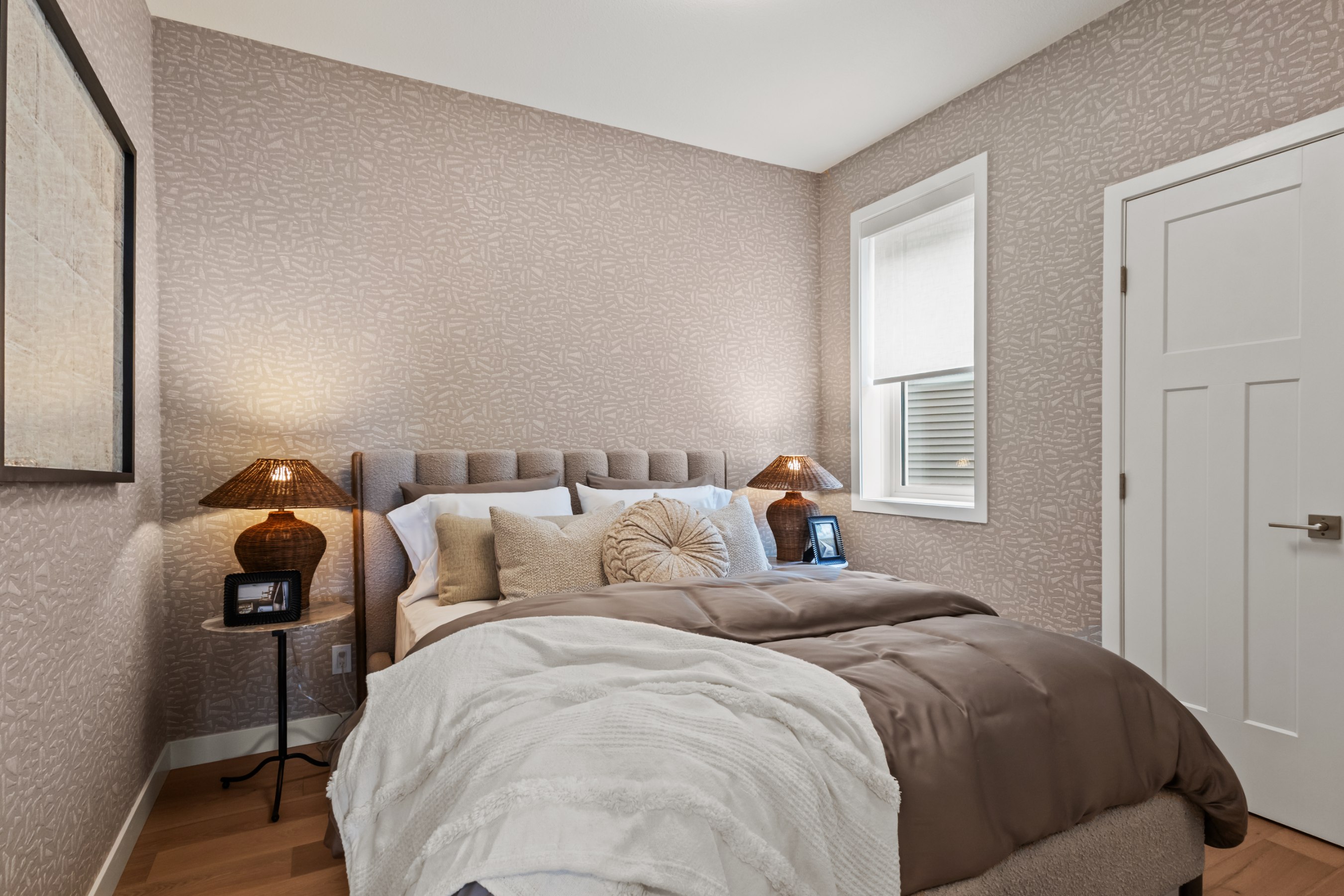 A photo of the bedroom on the main floor of the Waterton 26 model in Edmonton by Brookfield Residential