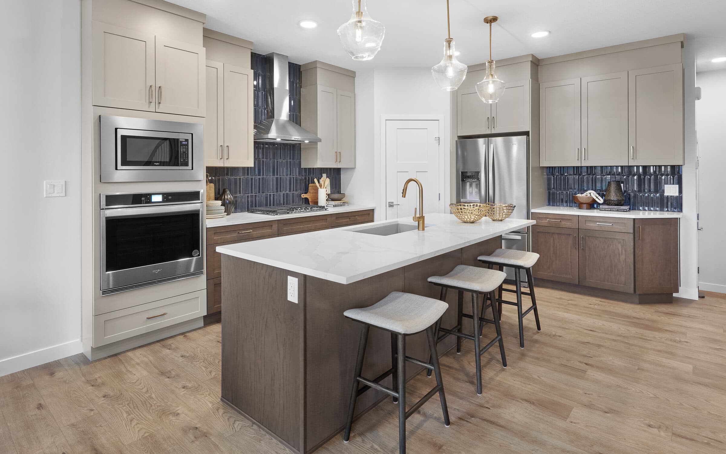 A kitchen in The Robson in The Orchards by Brookfield Residential in Edmonton Alberta.