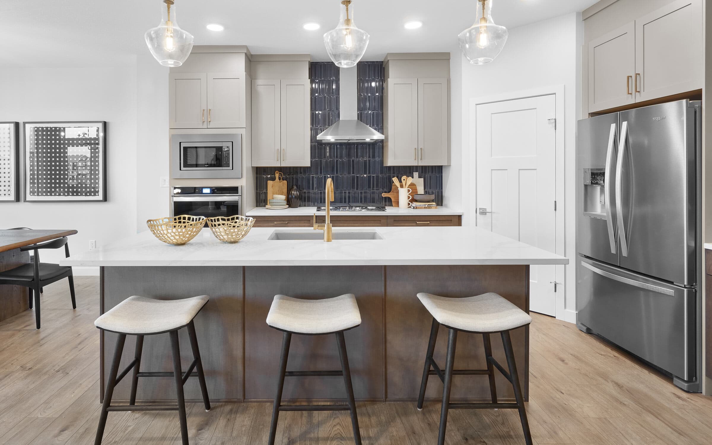 A kitchen in The Robson in The Orchards by Brookfield Residential in Edmonton Alberta.