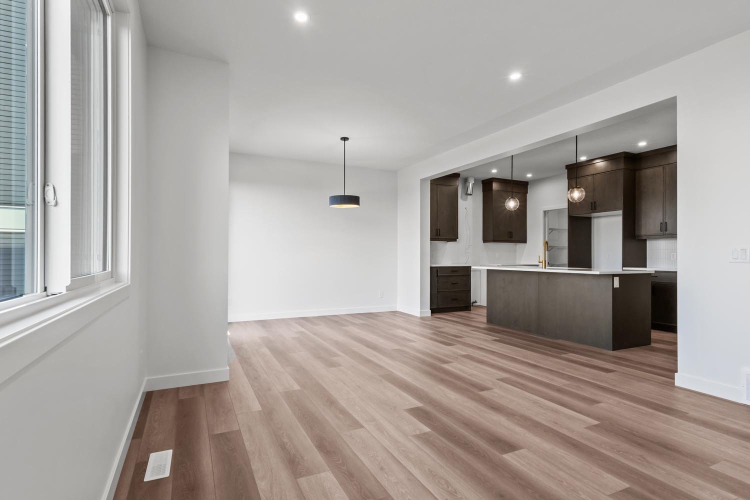 A photo of the front garage quick possession home at 2125 Muckleplum Crescent SW in The Orchards by Brookfield Residential