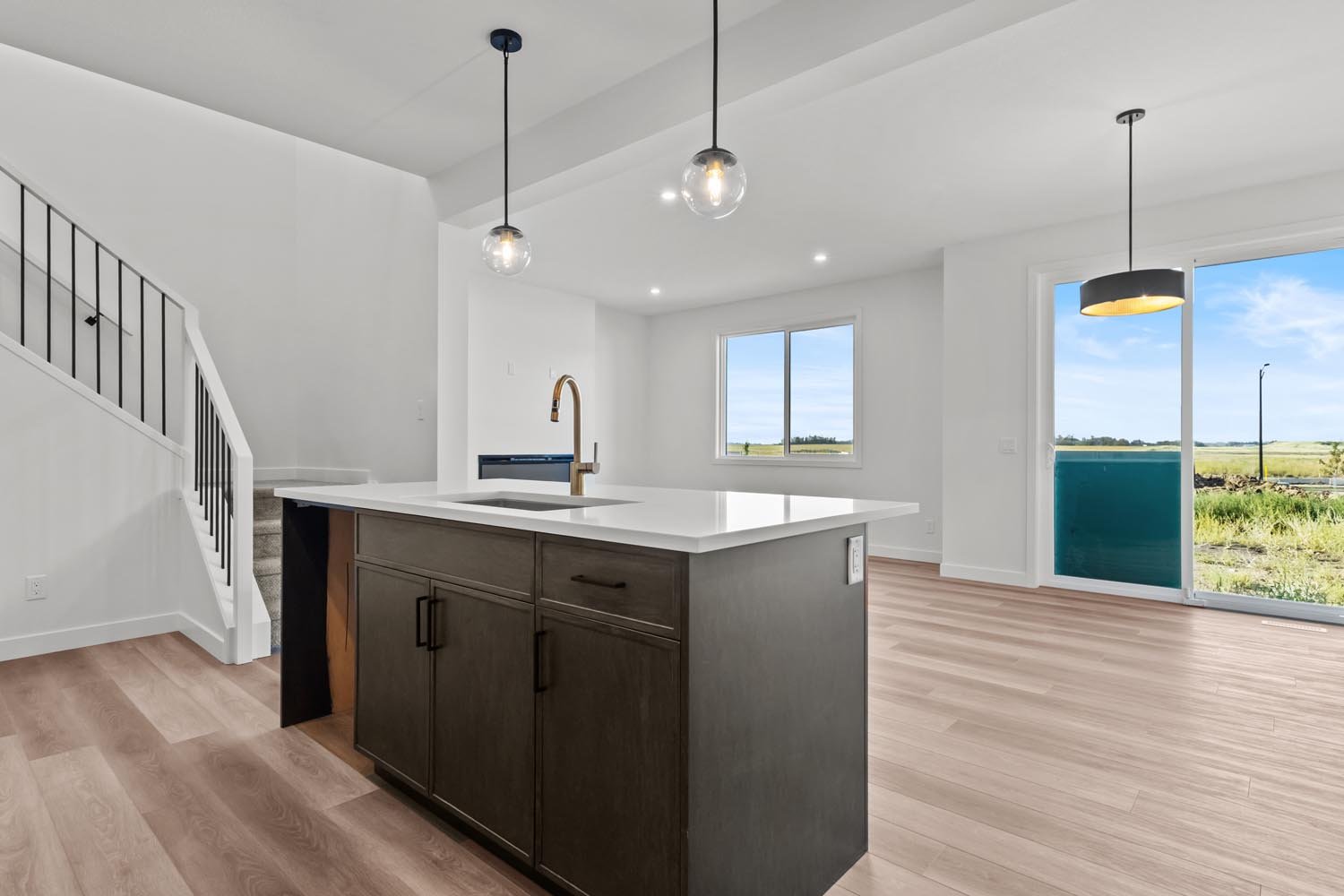 A photo of the front garage quick possession home at 2125 Muckleplum Crescent SW in The Orchards by Brookfield Residential