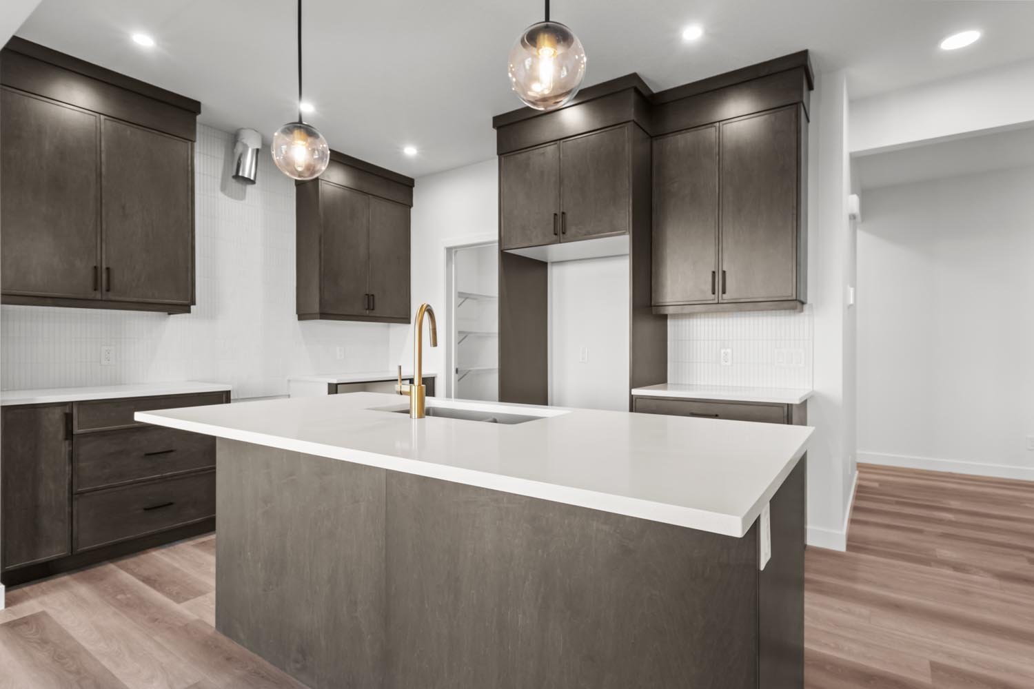 A photo of the front garage quick possession home at 2125 Muckleplum Crescent SW in The Orchards by Brookfield Residential