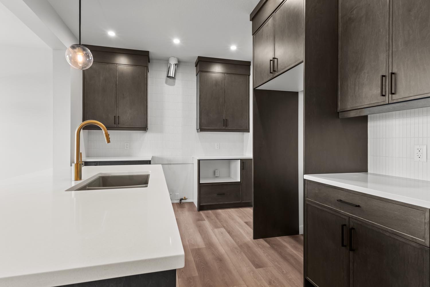 A photo of the front garage quick possession home at 2125 Muckleplum Crescent SW in The Orchards by Brookfield Residential