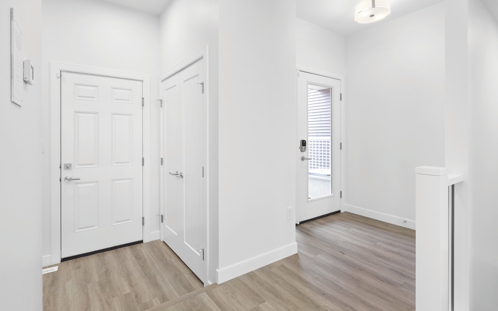 Foyer and entry from the garage in the Cypress feature home in Edmonton, Alberta by Brookfield Residential