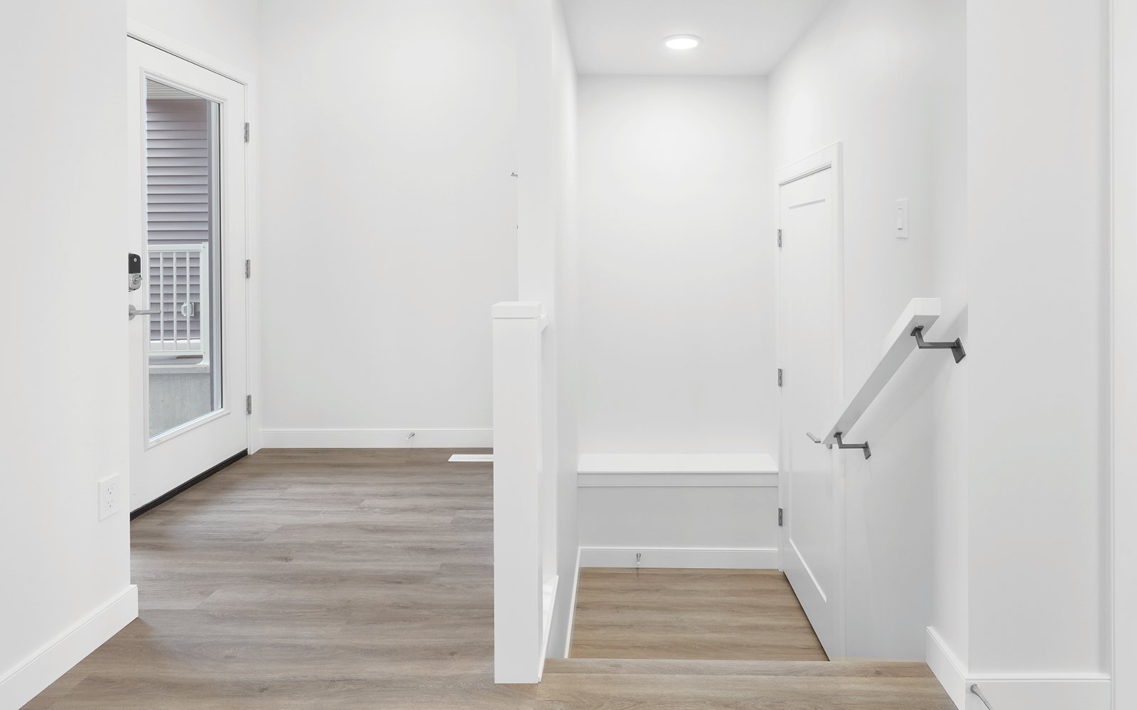 Foyer and entry to the basement in the Cypress feature home in Edmonton, Alberta by Brookfield Residential