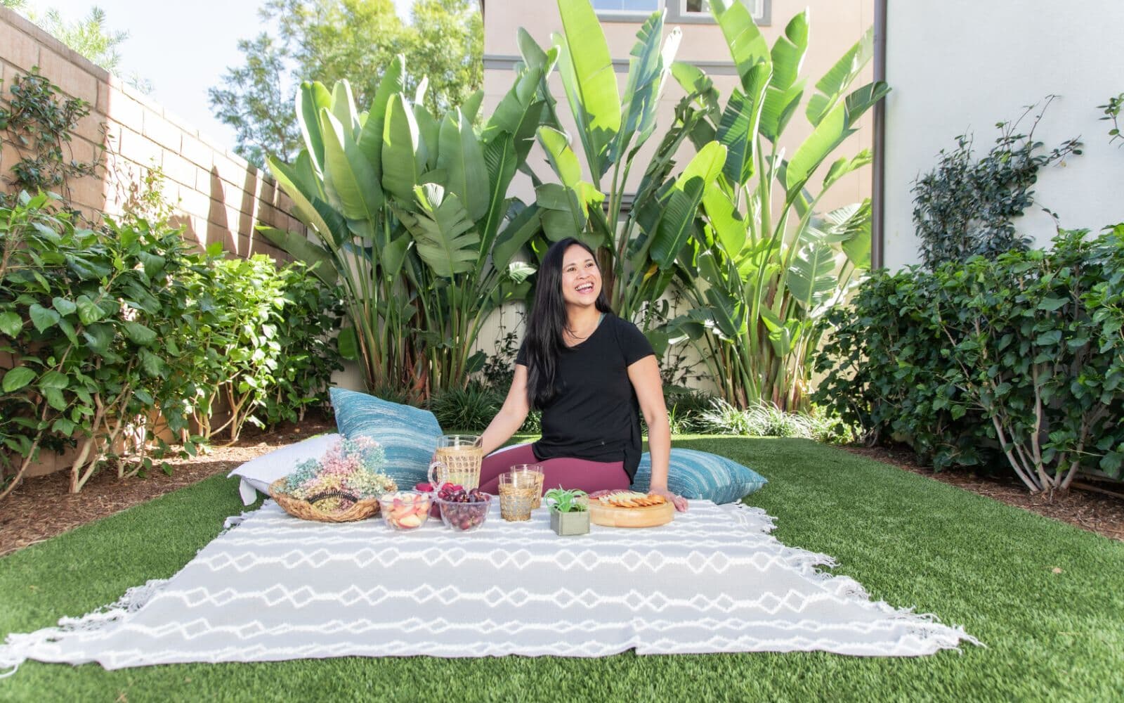 Women having an outdoor picnic in green space