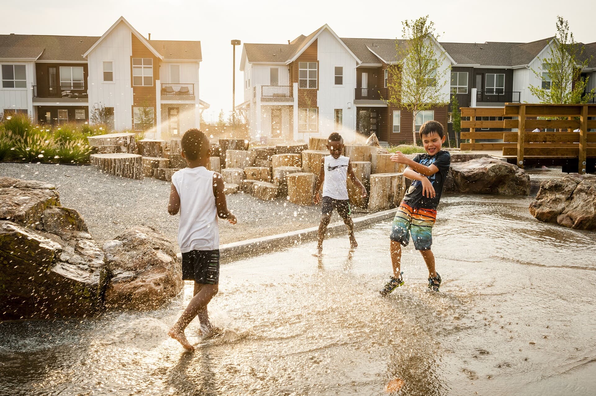 Lifestyle photo of kids playing outside at Central Park community in Denver, CO.