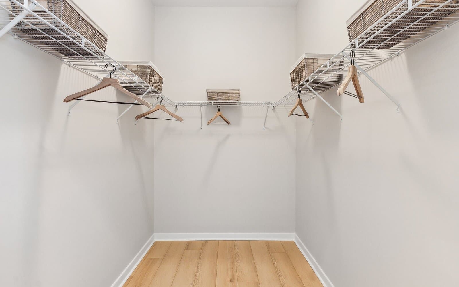 The main level primary bedroom walk-in closet the Quincy II at Heritage Shores by Brookfield Residential.