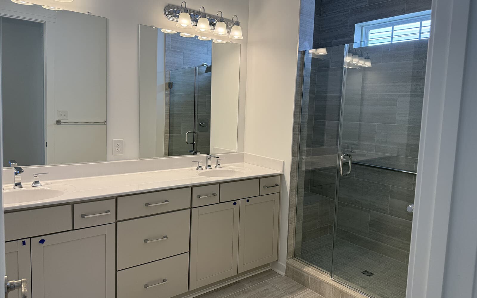 The main level primary bathroom of the Quincy II on homesite 1151 at Heritage Shores.