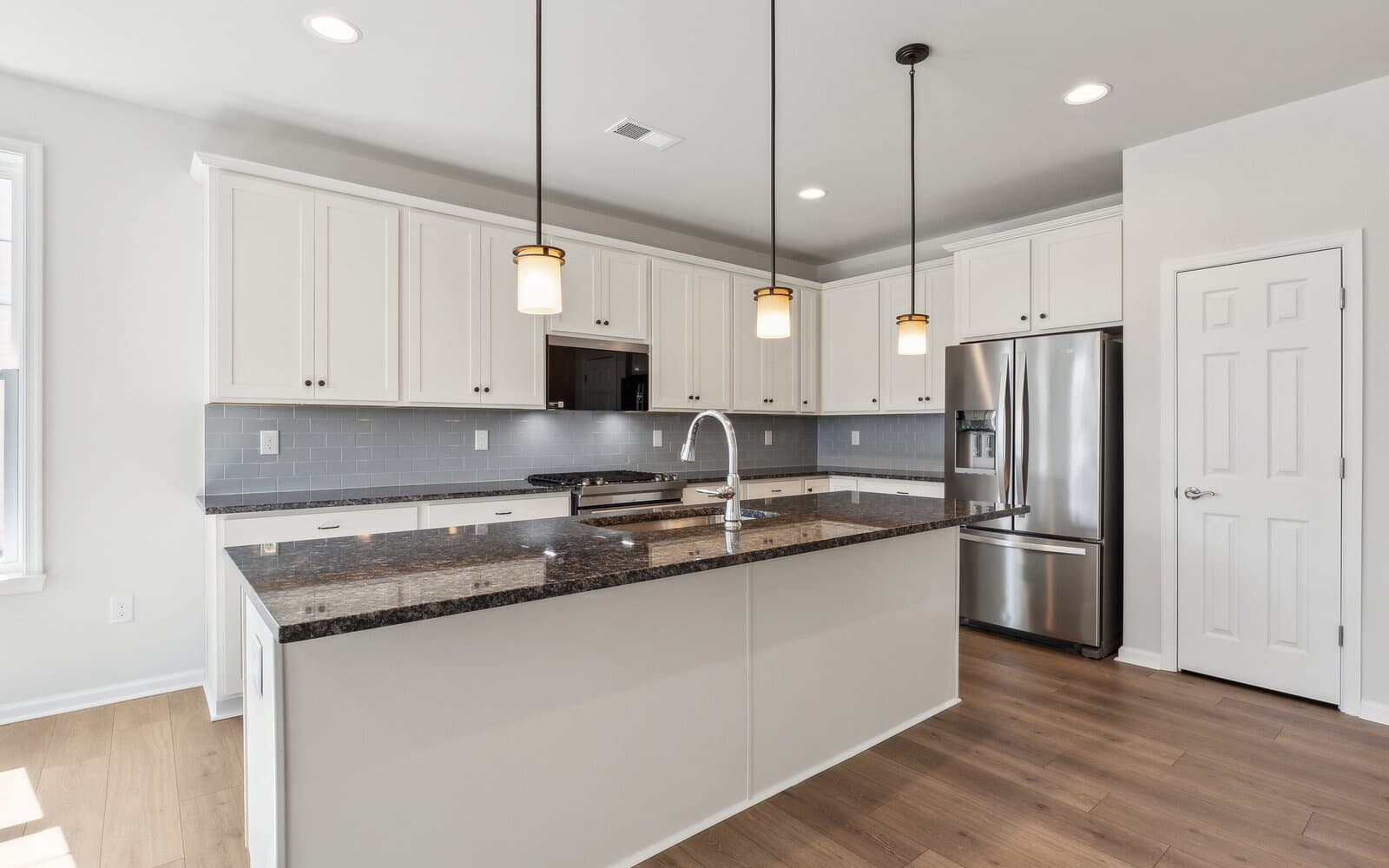 The kitchen of the Monet on homesite 983 at Heritage Shores by Brookfield Residential.