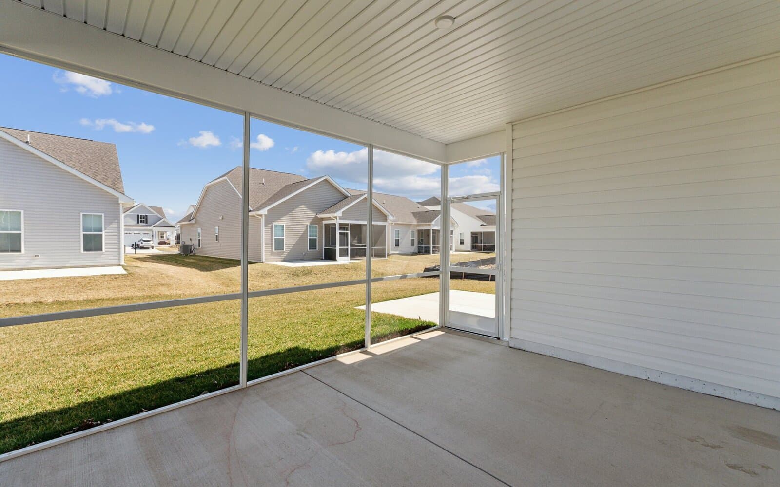 The rear screened porch of the Picasso on homesite 986 at Heritage Shores by Brookfield Residential.