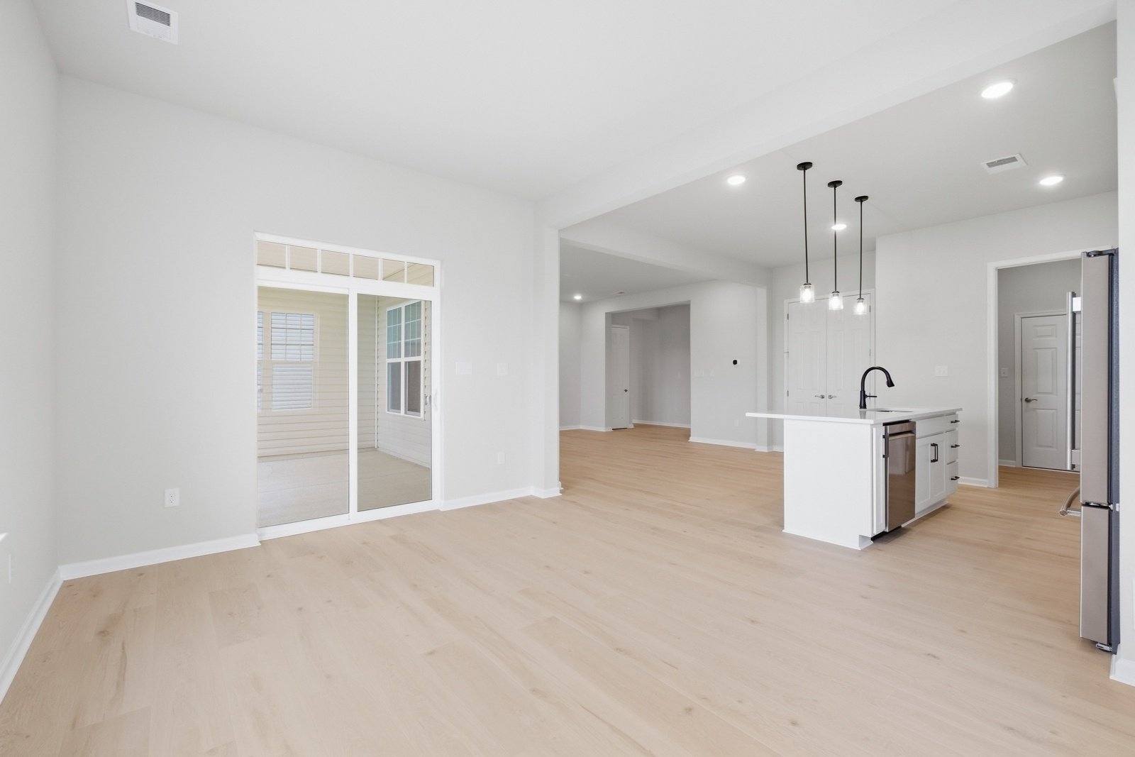 The dining room and kitchen of the Savoy II on homesite 989.