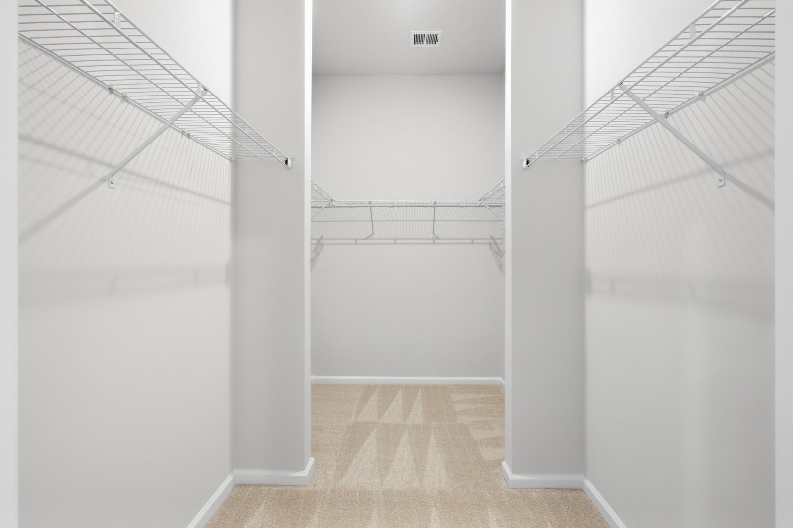 The main level primary suite walk-in closet of the Savoy II on homesite 989.