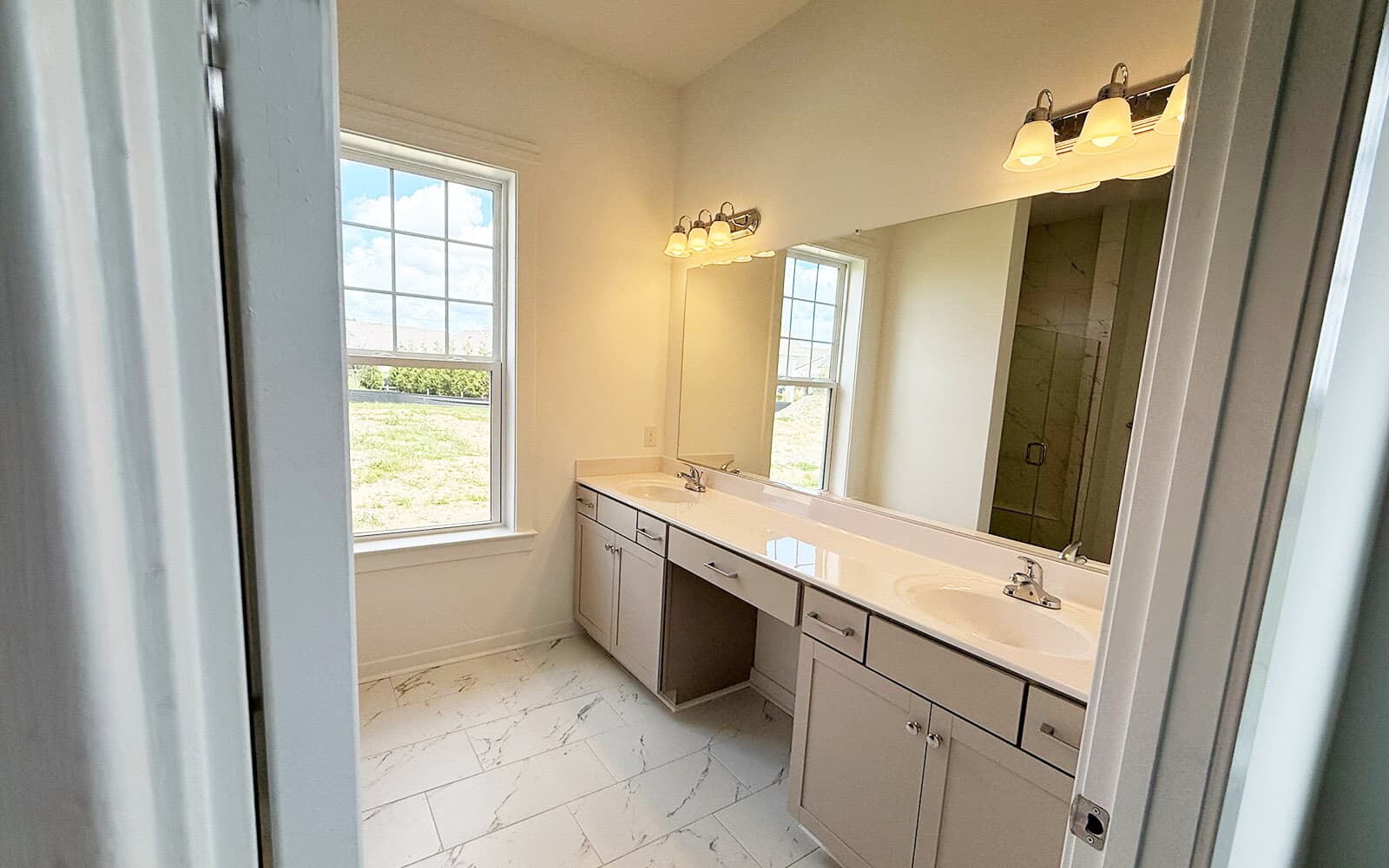 The main level primary bathroom of the Picasso at Heritage Shores on homesite 991. 