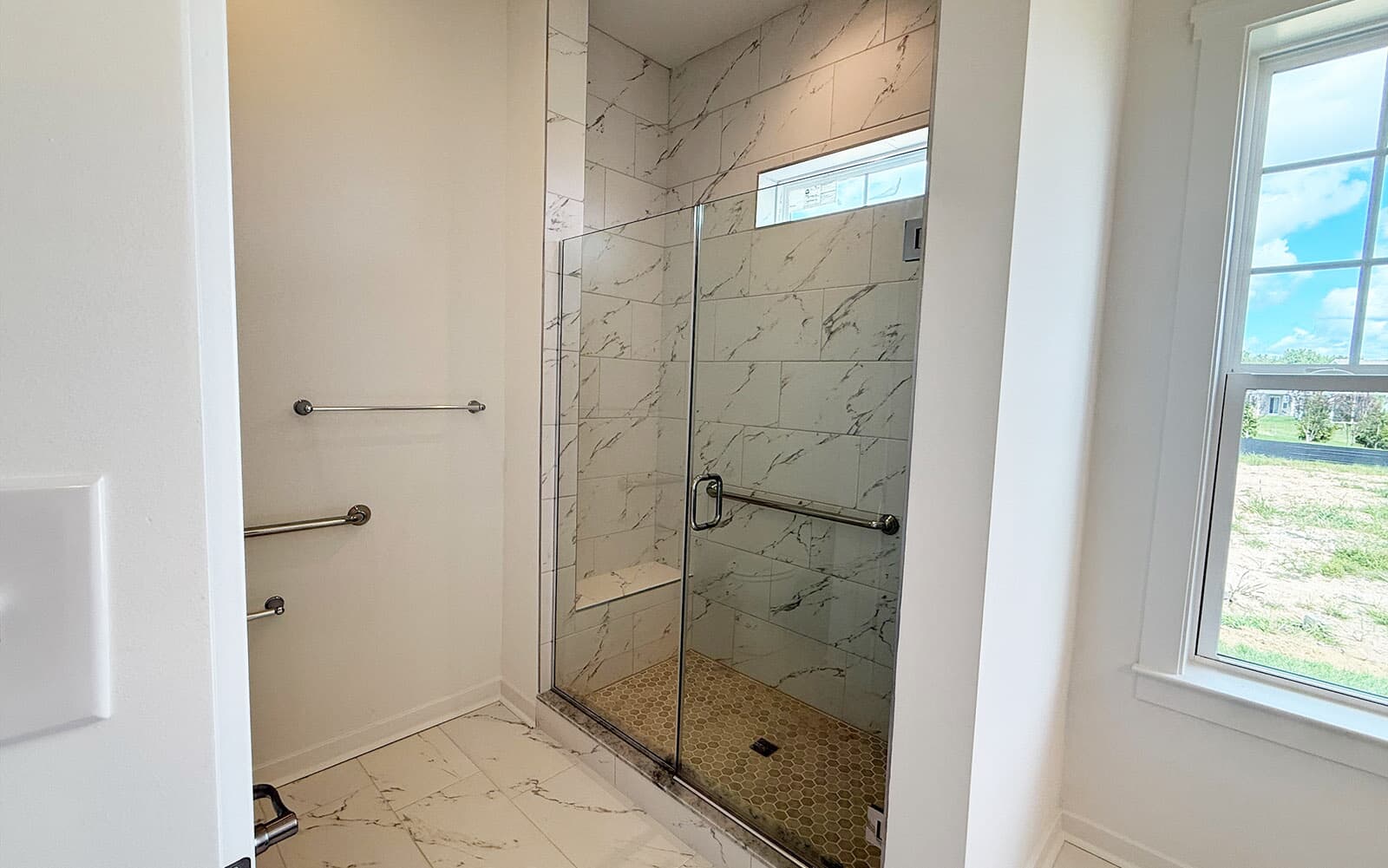The main level primary bathroom of the Picasso at Heritage Shores on homesite 991. 
