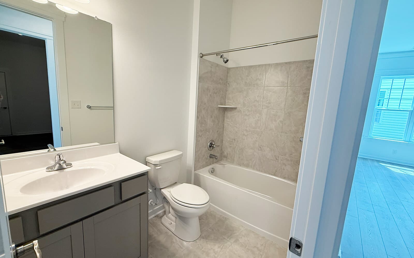 The main level secondary bathroom of the Picasso at Heritage Shores on homesite 991. 