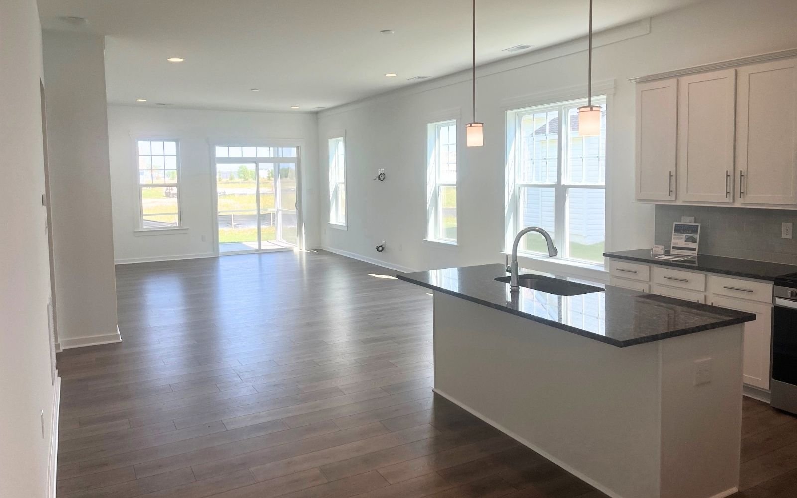 The kitchen and family room of the Picasso on homesite 991 at Heritage Shores.