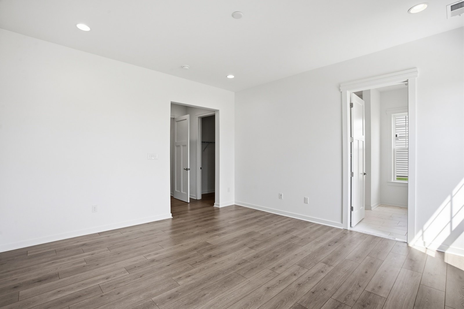 The main level primary suite of the Picasso on homesite 991.