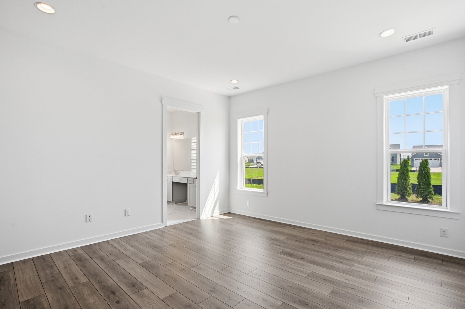 The main level primary suite of the Picasso on homesite 991.