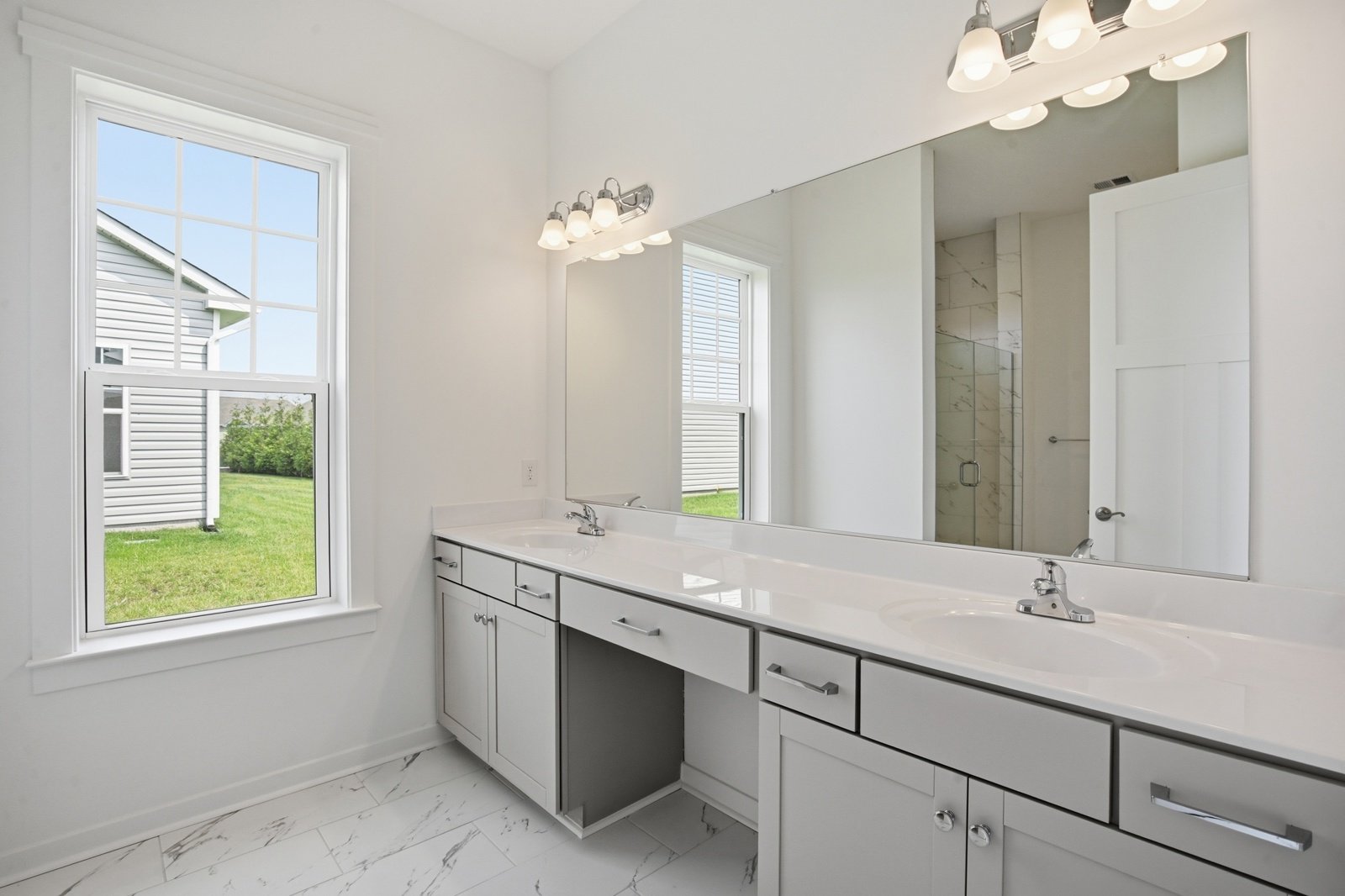The main level primary en suite bathroom of the Picasso on homesite 991.
