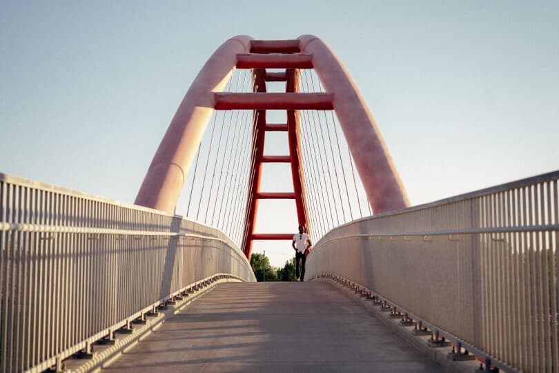 Man on a pedestrian bridge in Calgary AB