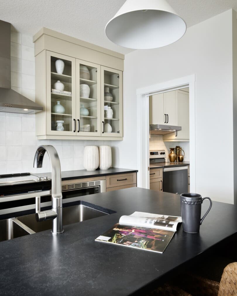 Kitchen and spice kitchen in Purcell at Livingston by Brookfield Residential in Calgary, AB