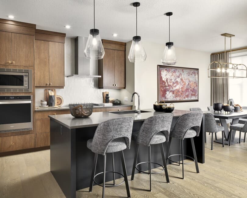 Wood tone kitchen in Robson at Livingston by Brookfield Residential in Calgary, AB