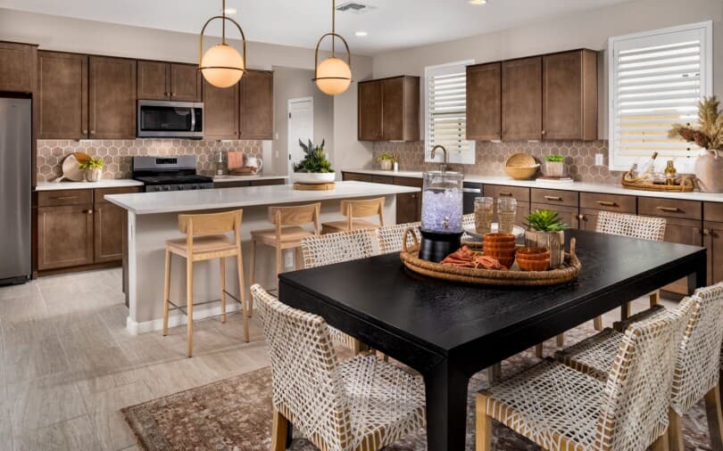 Brown tone kitchen in the Azure residence at Highland Sage at Alamar by Brookfield Residential in Avondale AZ