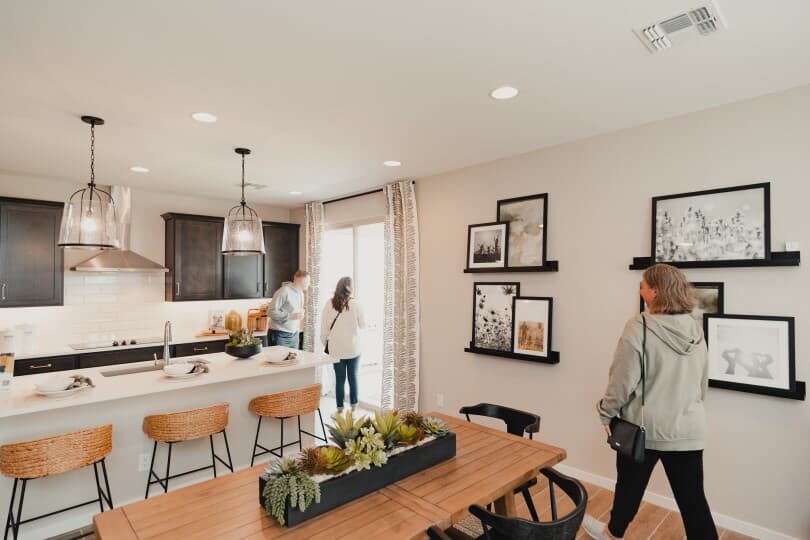 People walking through the new Dakota model home at Highland Sage by Brookfield Residential in Avondale AZ