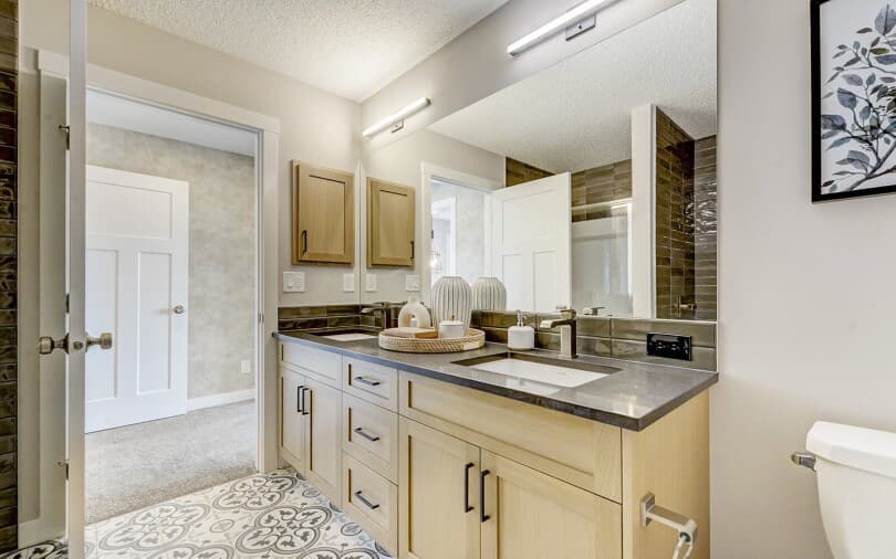 Bathroom in the Douglas laned home at Rockland Park by Brookfield Residential in Calgary AB