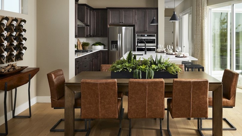 Dining and kitchen area in Signature 4 at Central Park by Brookfield Residential in Denver CO