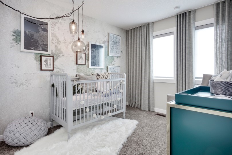 Nursery with a map mural in Carlisle at Livingston by Brookfield Residential Calgary