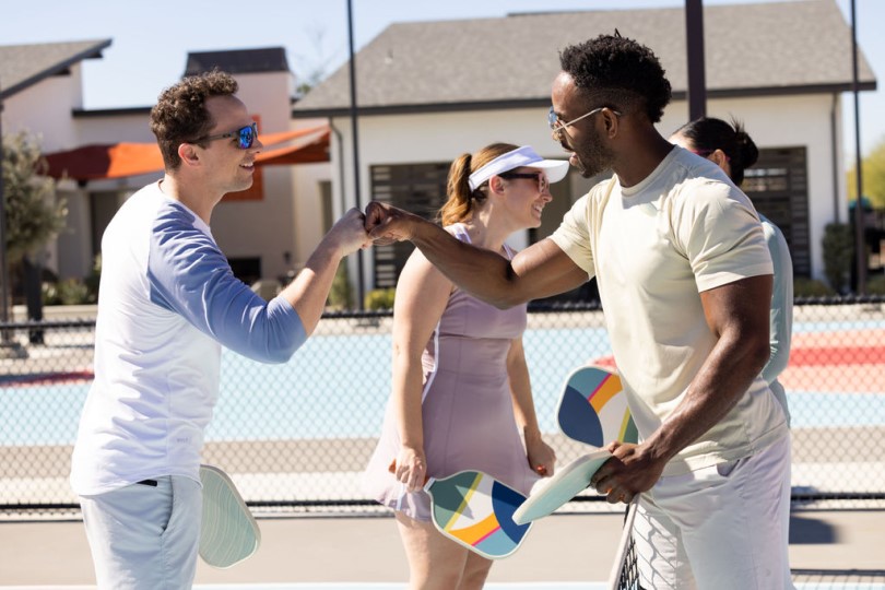 Neighbors playing pickleball at New Haven in Ontario Ranch CA
