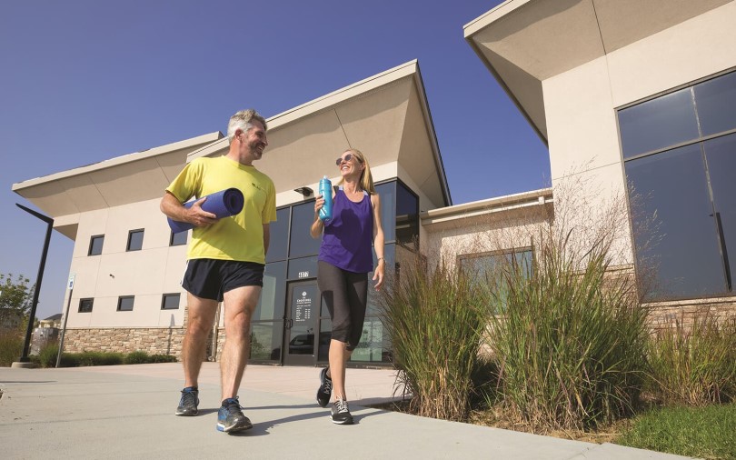 Couple leaving the fitness center at Brighton Crossings in Brighton CO